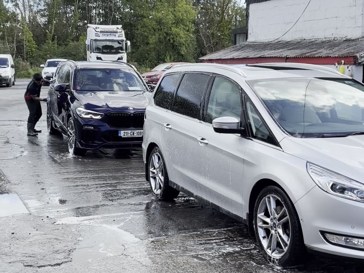 Cars being hand washed on the forecourt at Halpin’s Service Station