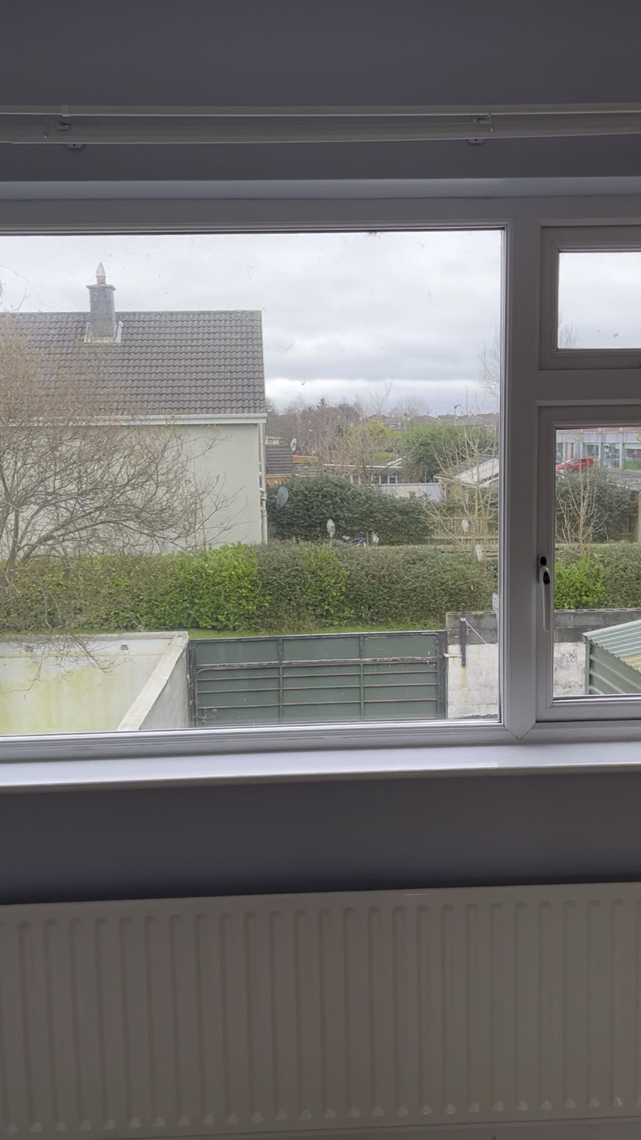 A repainted room in County Clare with a window and radiator